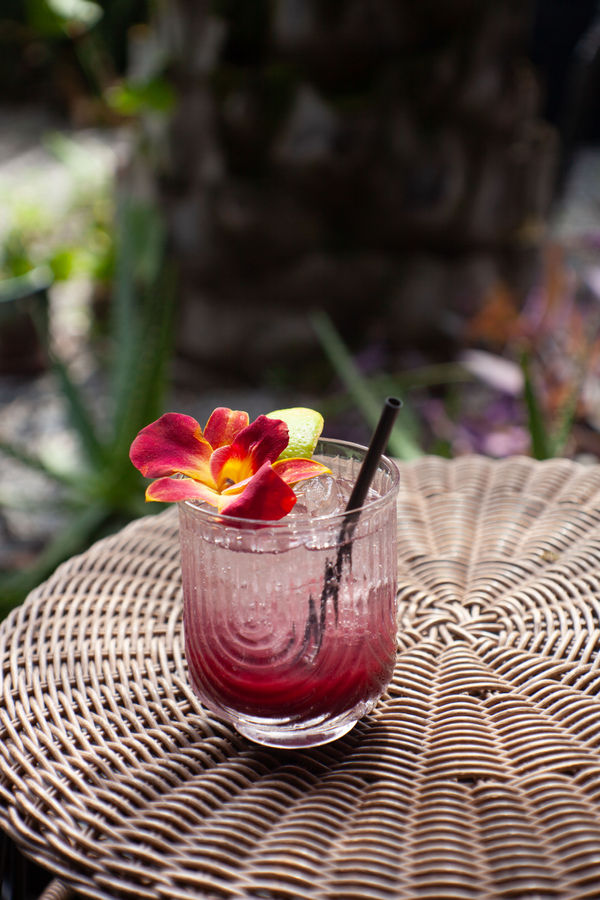Red signature cocktail on the patio
